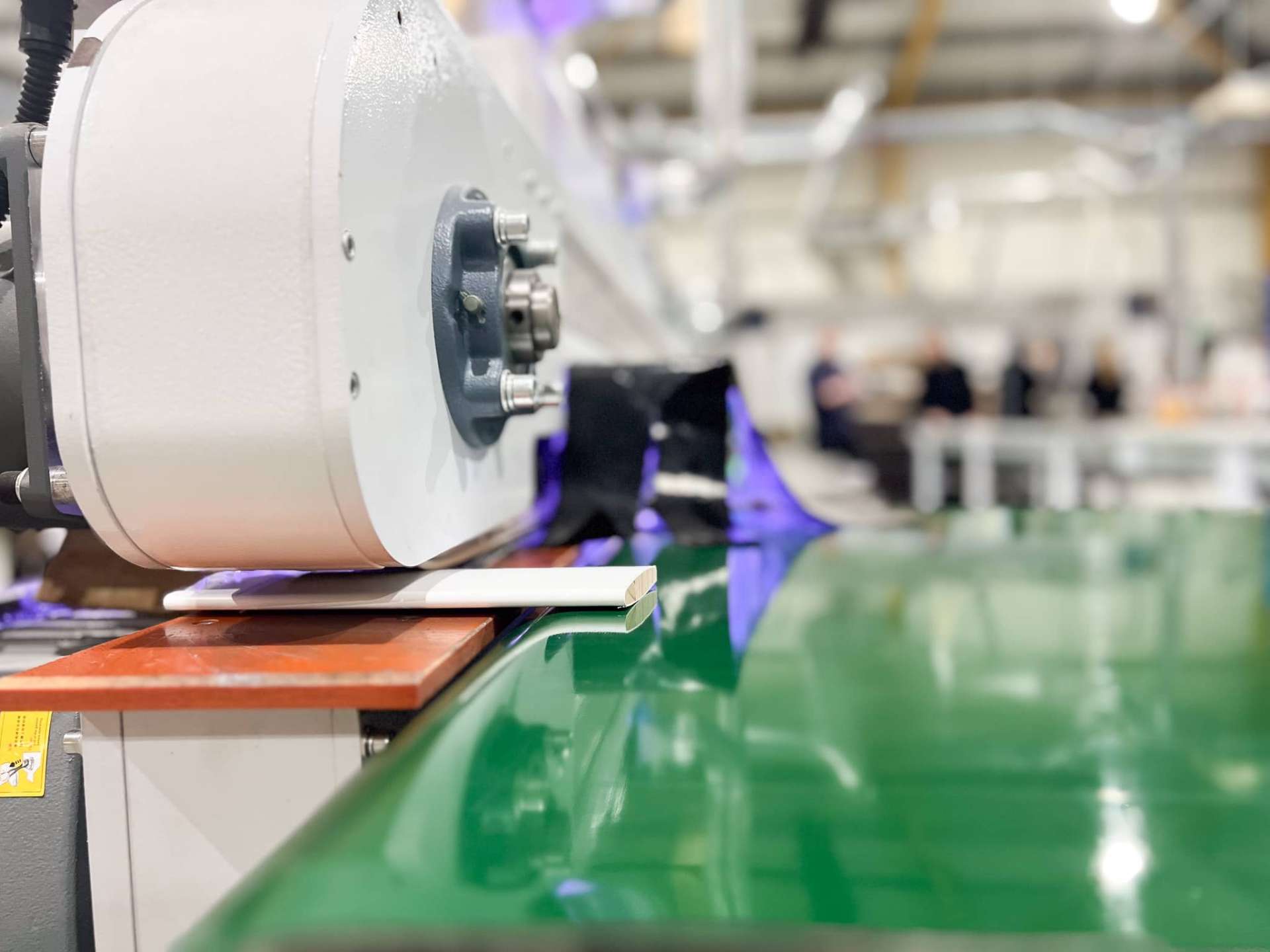 Inside the Jasper & Finch UK workshop - shutter components moving through the finishing line